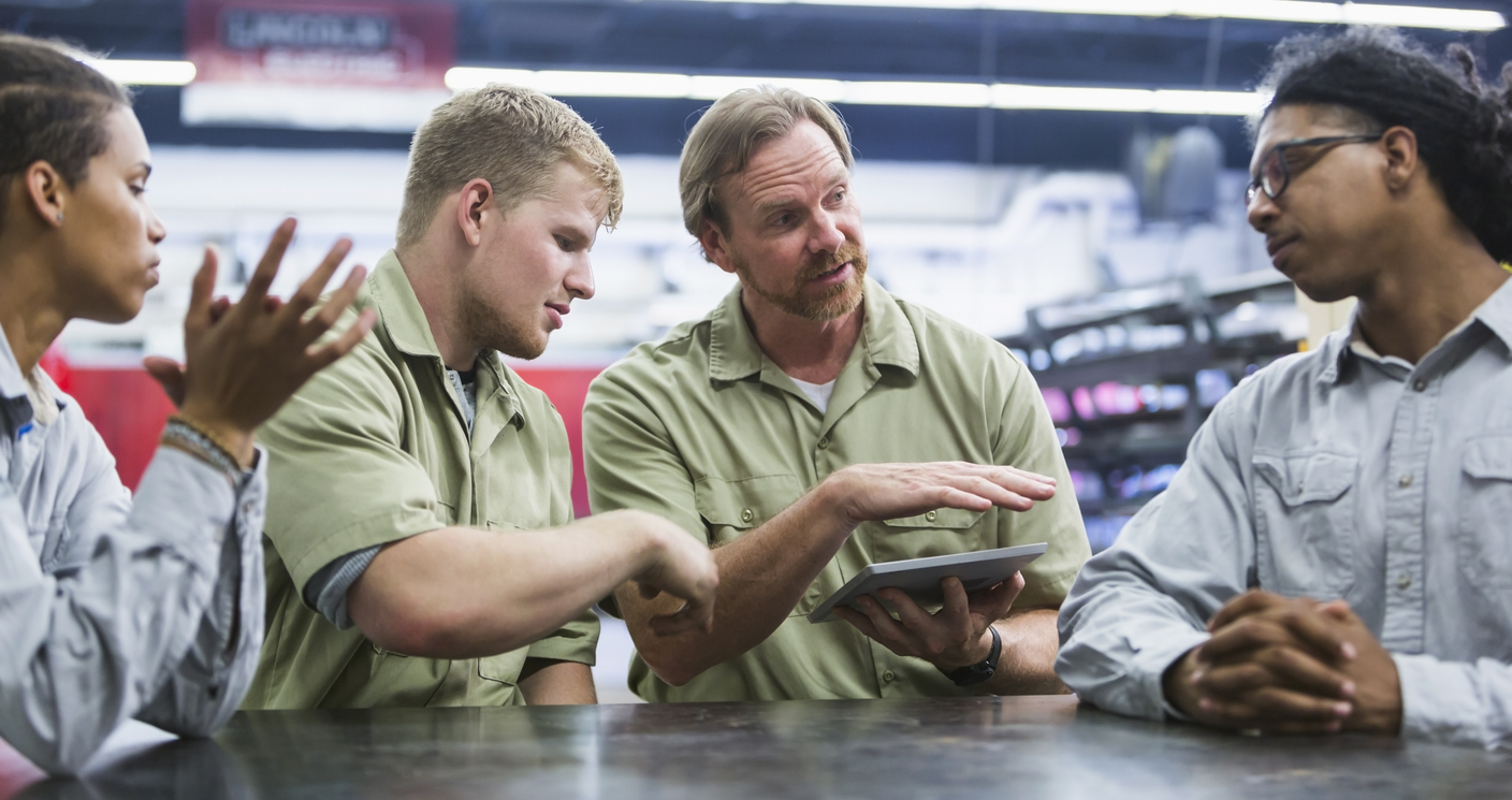 Instuctor and students in technical training school