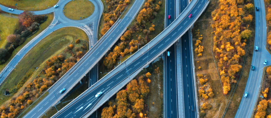 Photo shows motorway near Newbury UK in autumn where the trees are yellow.
